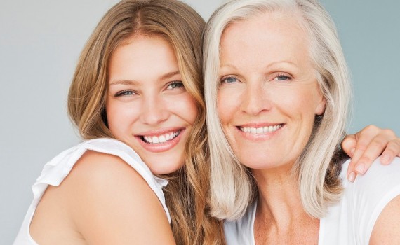 Portrait of smiling mother and daughter hugging