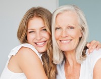 Portrait of smiling mother and daughter hugging